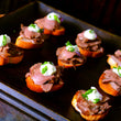 Load image into Gallery viewer, 100% grass-fed and field harvested braised buffalo tongue canapes on crositini