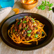 Load image into Gallery viewer, 100% grass-fed and field harvested ground buffalo picadillo on a black plate