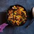 Load image into Gallery viewer, 100% grass-fed and field harvested curried bison short ribs in a skillet