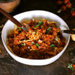 Load image into Gallery viewer, 100% grass-fed and field harvested bison italian sausage bolognese in a white bowl