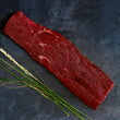 Load image into Gallery viewer, 100% grass fed and field harvested raw bison flat iron steak on a black background