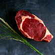 Load image into Gallery viewer, 100% grass-fed and field harvested raw bison ribeye steak