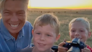 jill in the buffalo herd at sunset with her grandkids