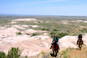 Dan O'Brien on horseback in south dakota