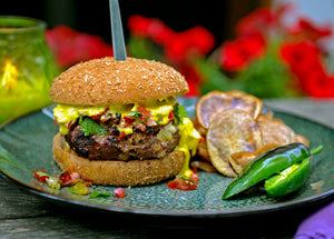 Southwest Bison Burger on bun with salsa and jalapeno hollandaise