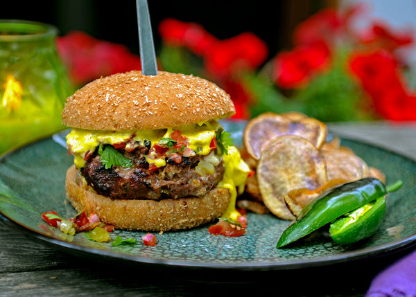 Southwest Bison Burger on bun with salsa and jalapeno hollandaise