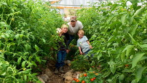 Jones family in their greenhouse garden 