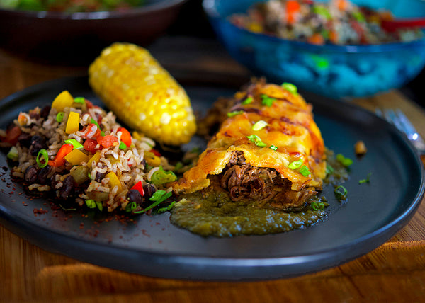 Pulled Bison Chuck Roast stuffed enchiladas with rice and corn