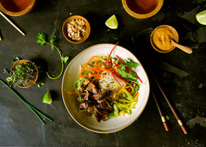 Bison Steak Bolgogi Style in bowl with vegetables & rice noodles