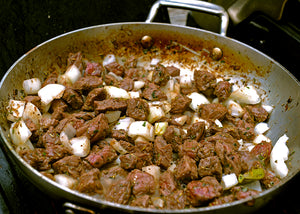 Bison Stew Meat sautéing in a skillet