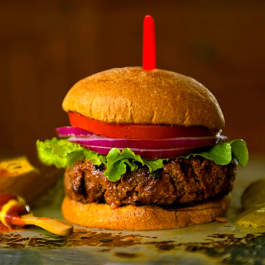 100% Grass Fed Grilled Bison Burger with Lettuce, Tomato & Onion on a bun