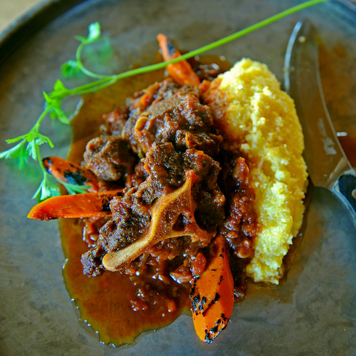 100% grass-fed and field harvested bison oxtail stew with polenta