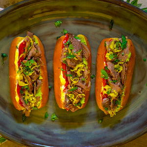 100% grass-fed and field harvested bison tongue sandwiches on a grey platter