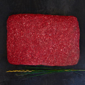 100% grass-fed and field harvested ground buffalo in a 5 lb. brick on a black background