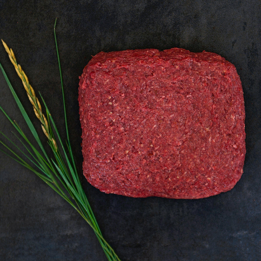 100% grass-fed and field harvested buffalo liver and trim blend on a black background