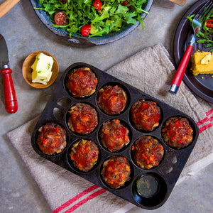 100% grass-fed and field harvested ground bison meatloaf muffins in a muffin tray on a towel on a plate