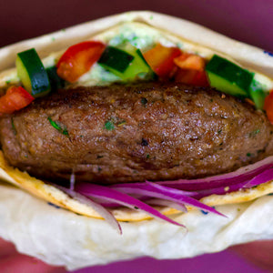 100% grass-fed and field harvested ground bison burger in a pita with fresh vegetables