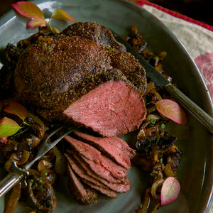 100% grass-fed and field harvested bison sirloin tip roast on a gray platter