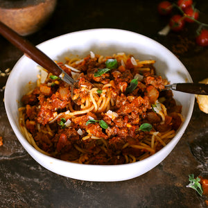 100% grass-fed and field harvested bison italian sausage bolognese in a white bowl