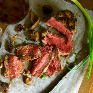 100% grass fed and field harvested grilled bison filet on parchment paper 