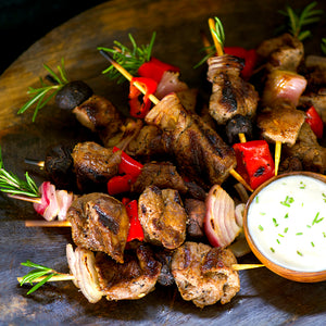 100% grass-fed and field harvested bison tenderloin tips on skewers with vegetables