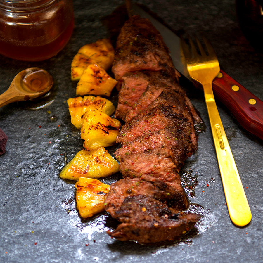 100% grass-fed and field harvested grilled bison teres major with pineapple