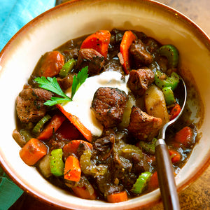 100% grass-fed and field harvested bison stew meat with carrots and celery in a bowl