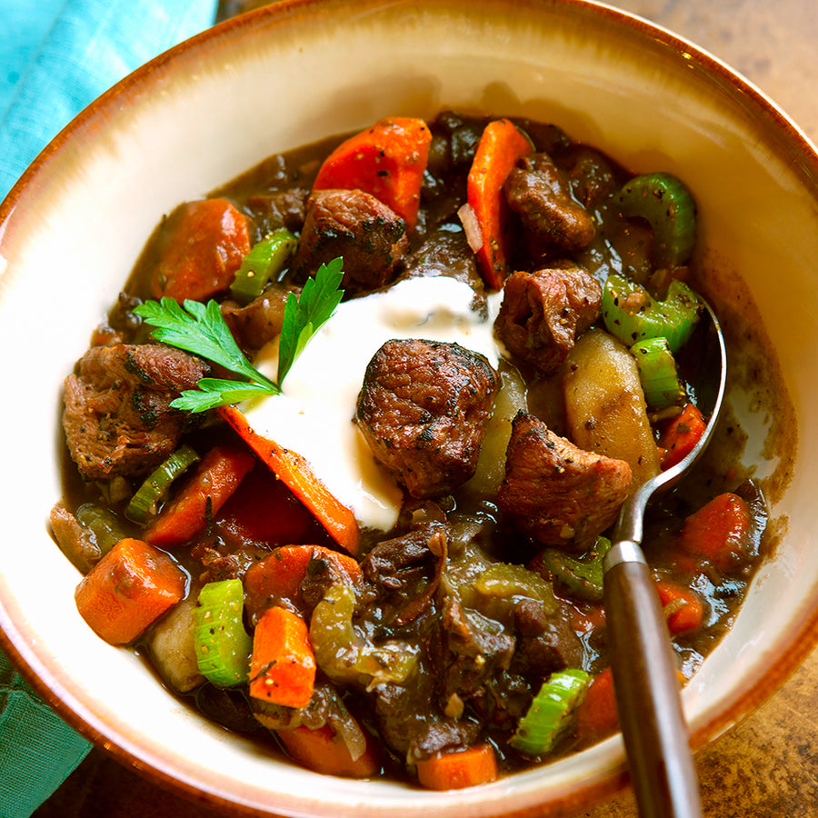 100% grass-fed and field harvested bison stew meat with carrots and celery in a bowl