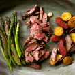 Load image into Gallery viewer, A plate with steak, potatoes, asparagus and asparagus.
