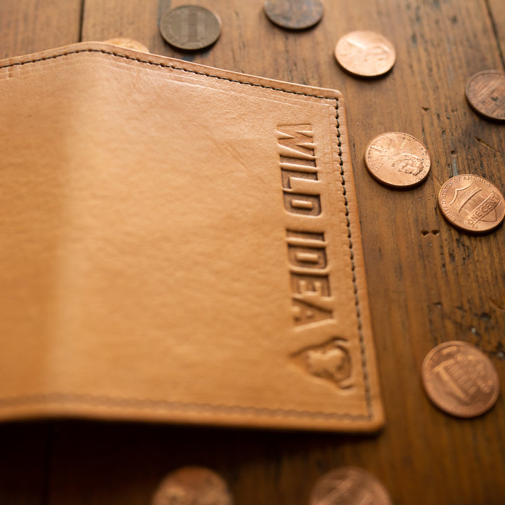 Closeup shot of buffalo leather card case with pennies in the background