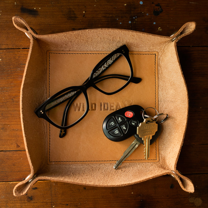 leather valet tray with glasses and keys in tray