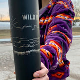 closeup shot of hand holding wild idea Climate+ water bottle